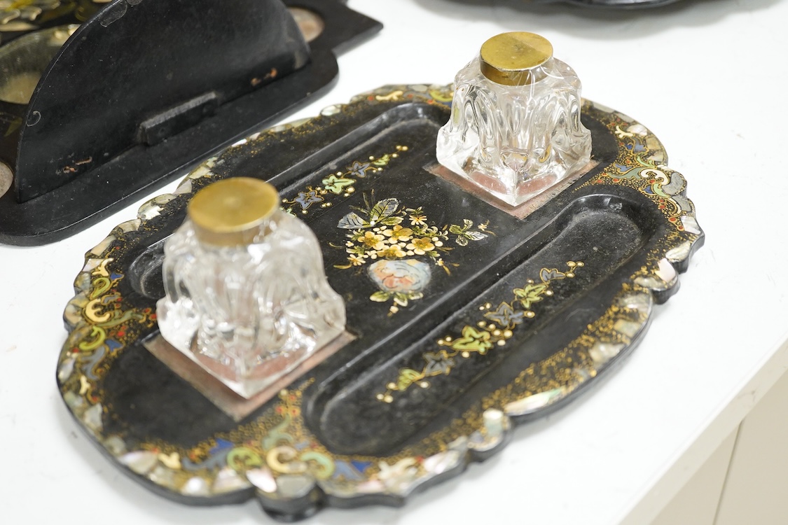 A collection of Victorian papier maché to include an inkstand, a pair of Victorian mirrored wall brackets and a swing handled dish, largest 30cm high